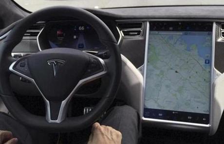 The interior of a Tesla Model S is shown in autopilot mode in San Francisco, California, U.S., April 7, 2016. REUTERS/Alexandria Sage/File Photo
